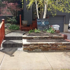 Eclectic Landscape with ledger stone raised flower beds