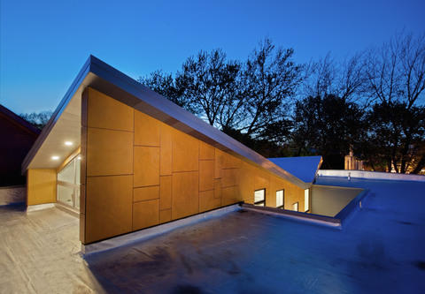 Modern Home Exterior with hot tar roof with applied sealant