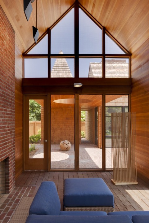 Modern Sunroom with floor to ceiling window