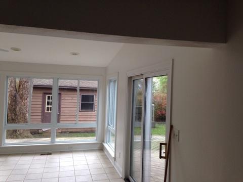 Contemporary Sunroom with sliding glass doors