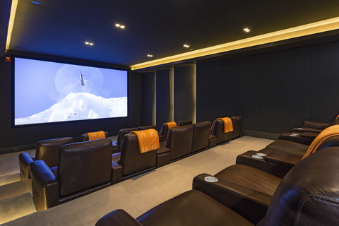Traditional Home Theater with brown leather movie recliners