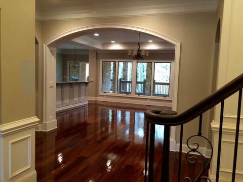 Colonial Dining Room with curved dark wood railing