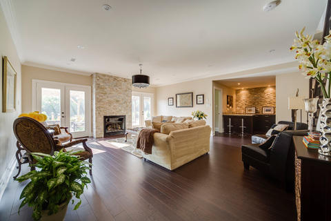 Transitional Living Room with stacked stone fireplace