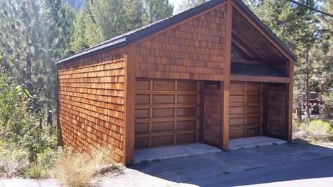 Eclectic Garage with panel garage doors
