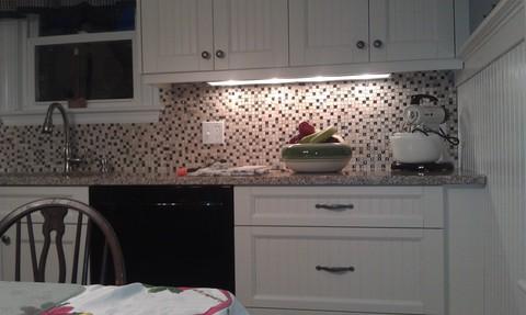 Cottage Kitchen with brushed nickel cabinet hardware