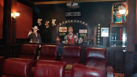 Traditional Home Theater with dark wood raised panel cabinets