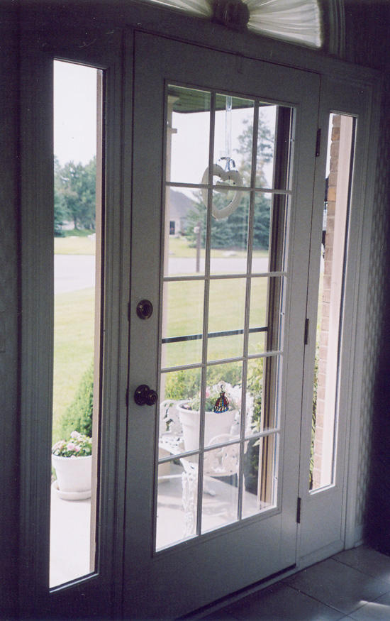 Traditional Entry with windows around door
