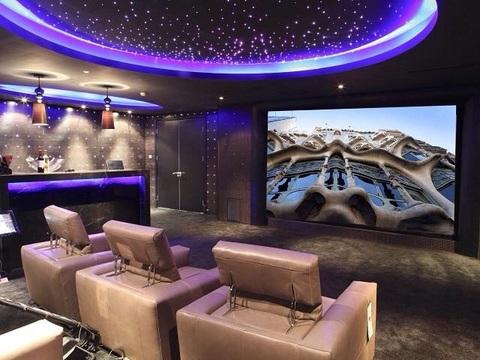 Traditional Home Theater with beige leather theater seat