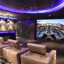 Traditional Home Theater with beige leather theater seat