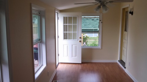 Transitional Sunroom with aluminum door with upper window panel