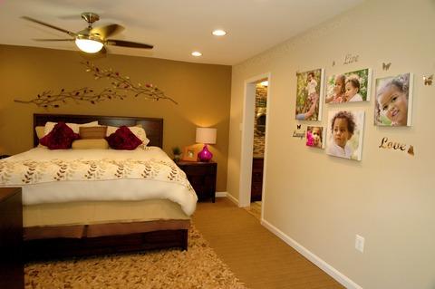Traditional Bedroom with mustard colored accent wall