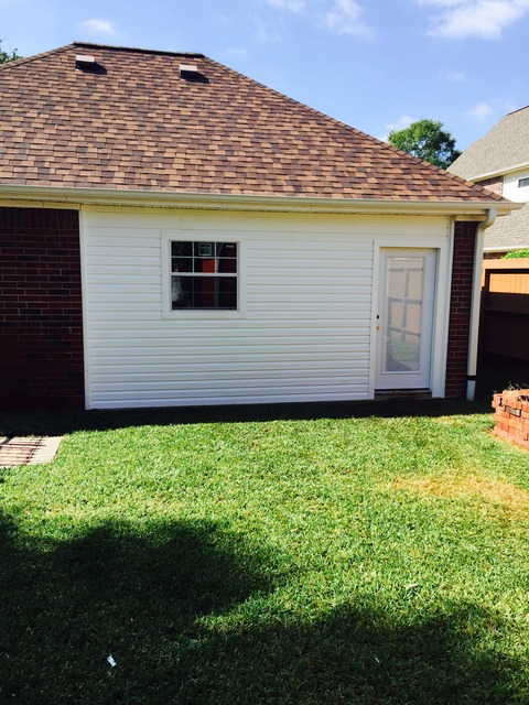 Transitional Garage with architectural compostion roof
