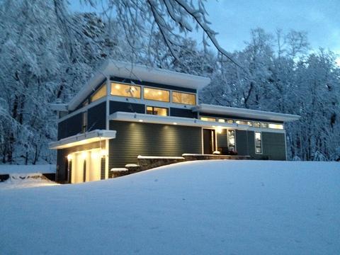 Modern Home Exterior with white fiber cement butterfly roof
