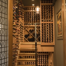 Contemporary Wine Cellar with light wood bottle storage