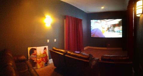Traditional Home Theater with dark gray painted walls