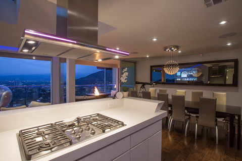 Modern Dining Room with stainless steel range hood
