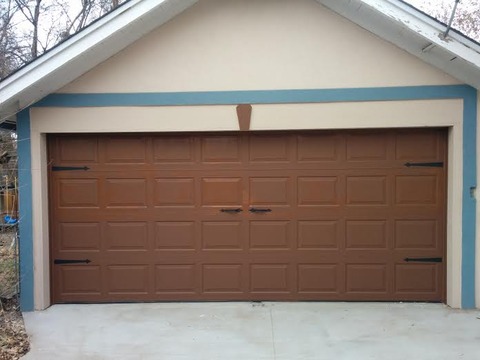 Transitional Garage with carriage style garage door