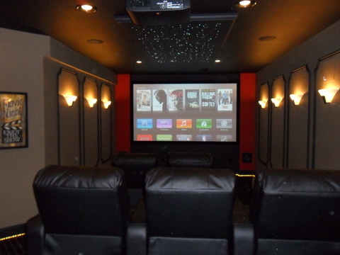 Art Deco Home Theater with black leather theater seating