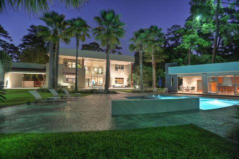Modern Home Exterior with attached in-ground hot tub