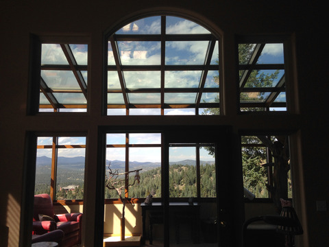 Contemporary Sunroom with red leather club chair