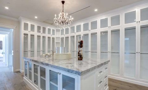 Traditional Closet with gray granite countertop