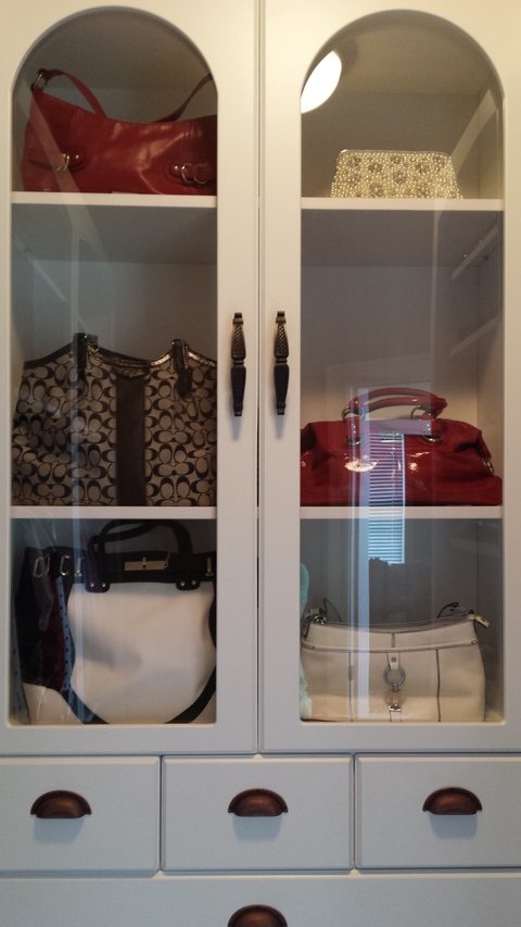 Traditional Closet with windowed cabinet door