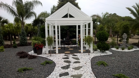 Modern Home Exterior with white crushed rock pathway