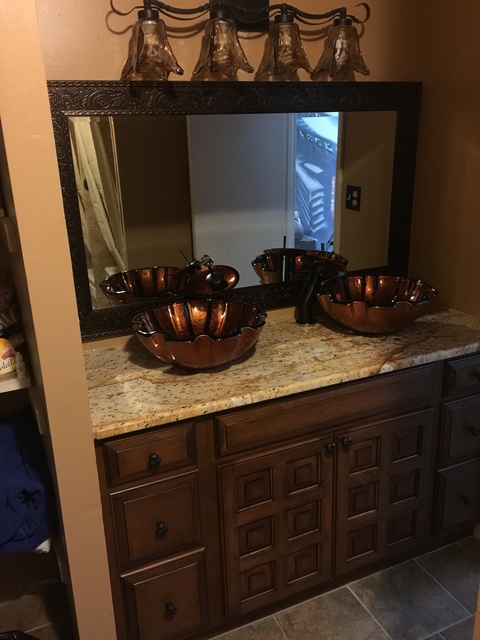 Eclectic Bathroom with amber glass vanity lights