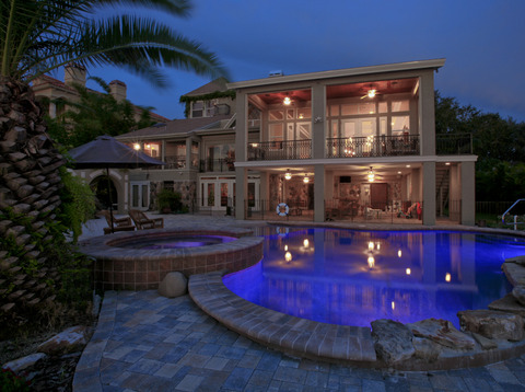 Eclectic Pool with stone paver patio