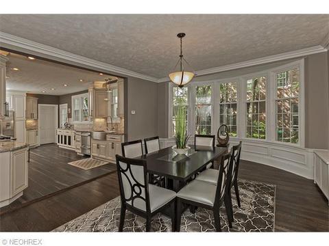 Transitional Dining Room with distressed brown pattern area rug