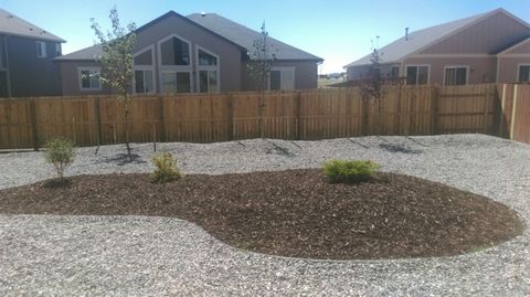 Eclectic Landscape with wood privacy fence