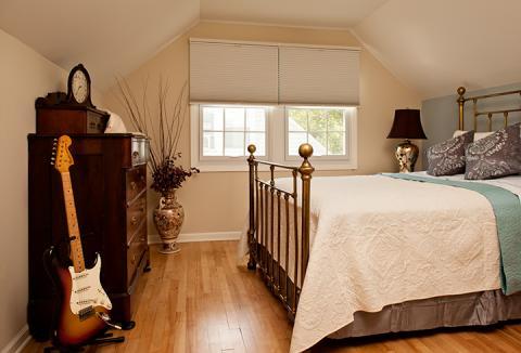 Traditional Bedroom with gold table lamp with dark brown shade