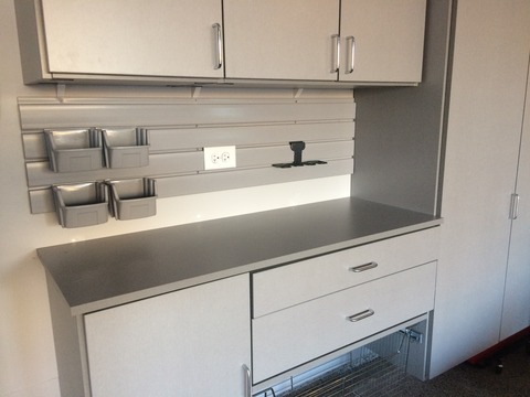Contemporary Garage with slab front cabinet door