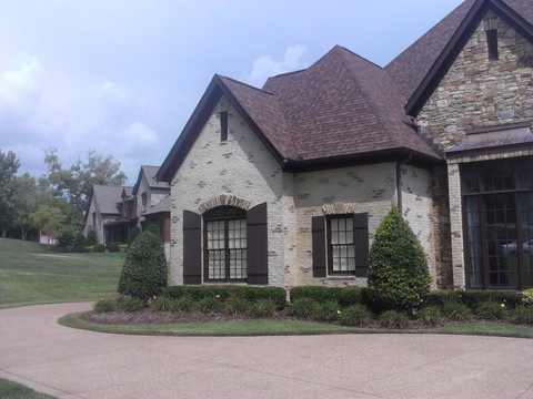 Tuscan Home Exterior with dry stacked stone accents