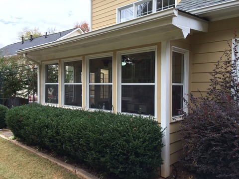 Transitional Sunroom with golden tan exterior