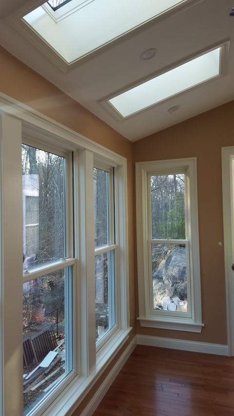 Transitional Sunroom with narrow plank wood floor