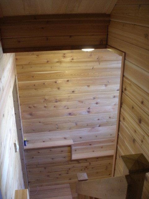 Rustic Pool with wood paneled walls