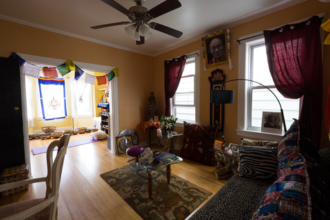 Eclectic Family Room with grommet top burgandy curtains