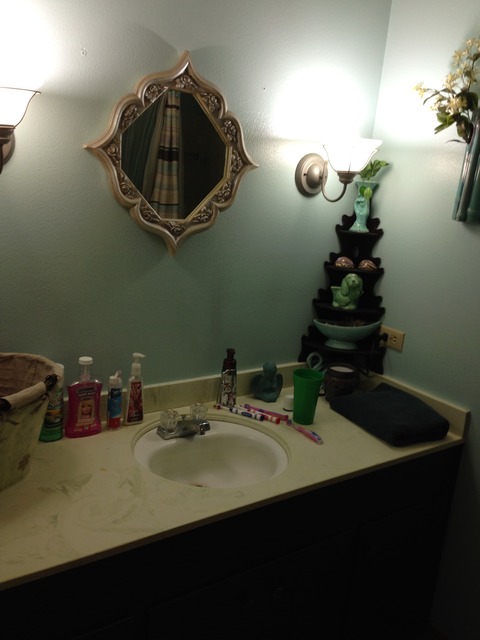 Traditional Bathroom with small framed vanity mirror