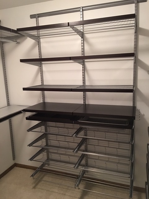 Traditional Closet with stained wood baseboard