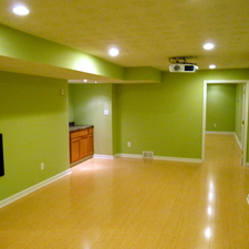 Eclectic Home Theater with bright green wall paint