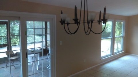 Casual / Comfortable Sunroom with porcelain tile floor
