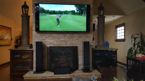 Eclectic Family Room with stone fireplace surround
