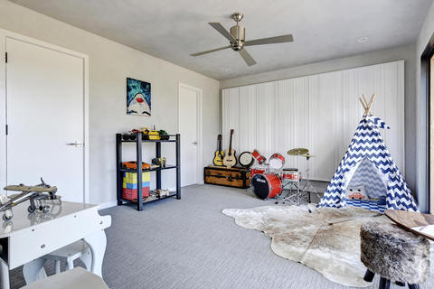 Eclectic Kids Room with stainless steel ceiling fan