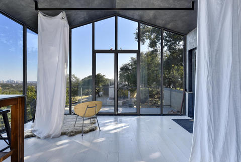 Contemporary Sunroom with white painted plank wood floor