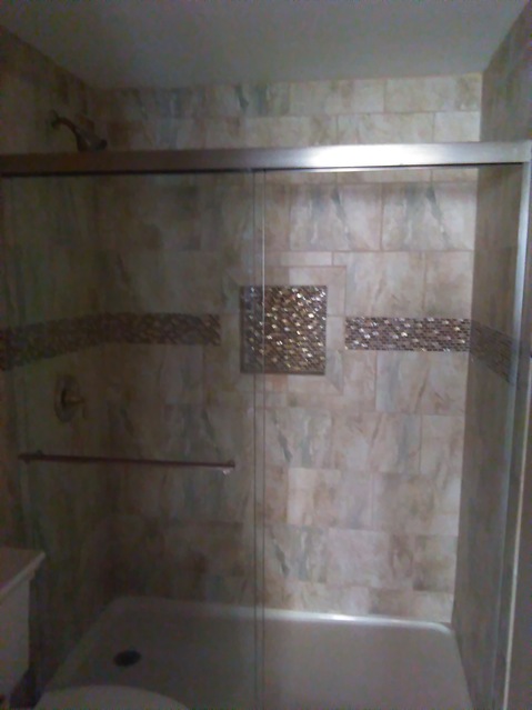 Traditional Bathroom with stainless steel shower door frame