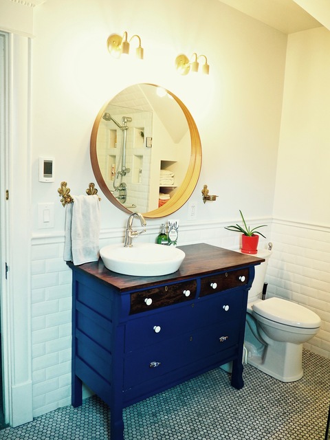 Eclectic Bathroom with beveled edge white subway tile