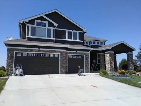 Modern Home Exterior with dark brown exterior paint