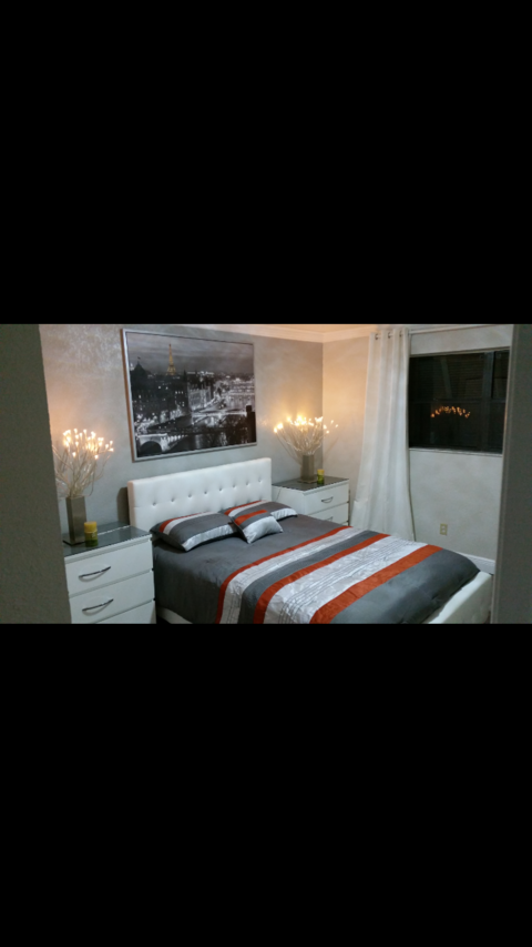 Contemporary Bedroom with tufted white leather headboard