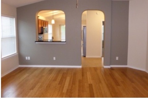 Contemporary Dining Room with arched pass through